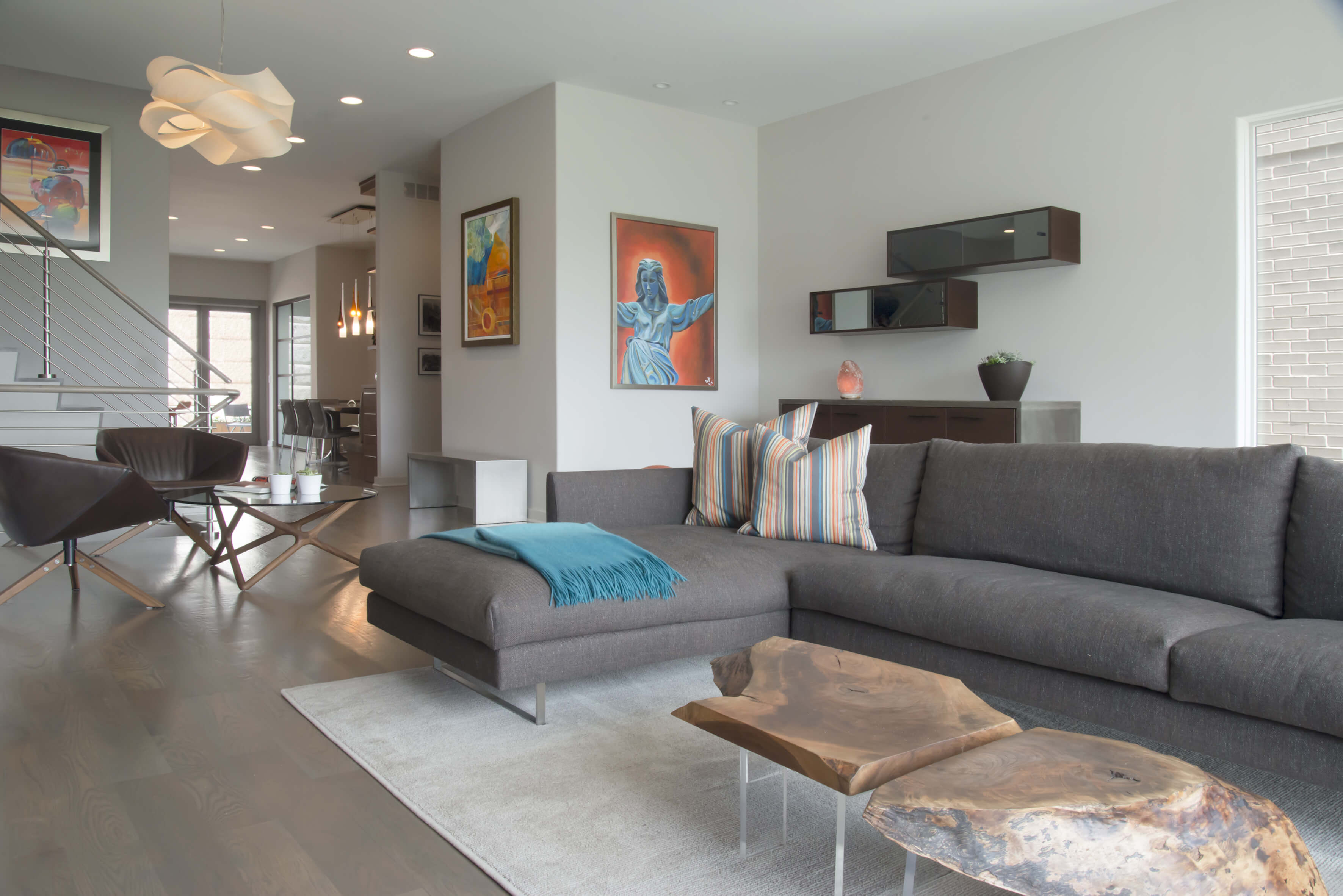 Contemporary living room utilizing plush furniture and natural materials all designed by Interior Designer, RM Interiors.