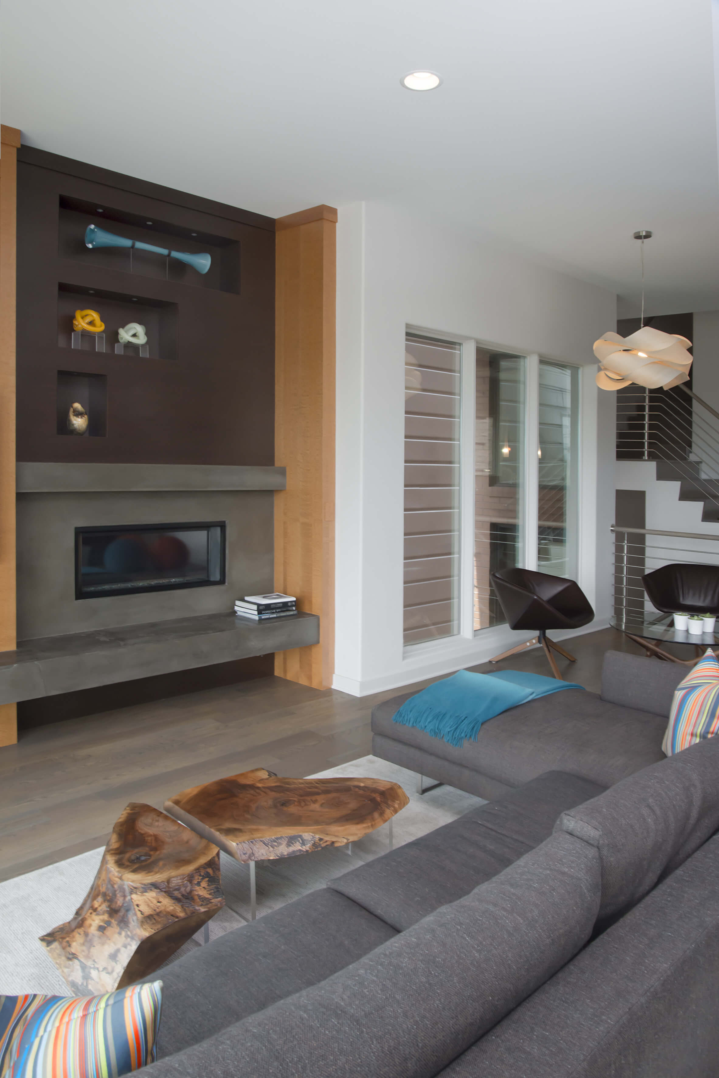 Living room featuring custom contemporary stone fireplace. Design by Cincinnati Interior Designer, RM Interiors.