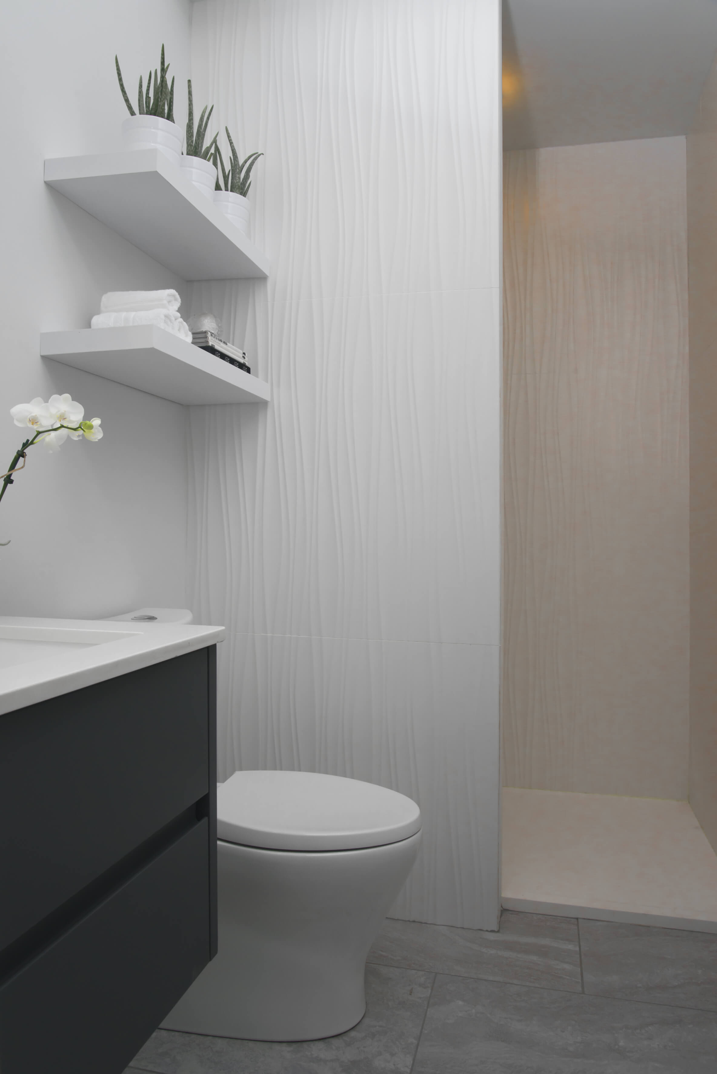 White and minimal bathroom designed by Cincinnati Interior Designer, RM Interiors.