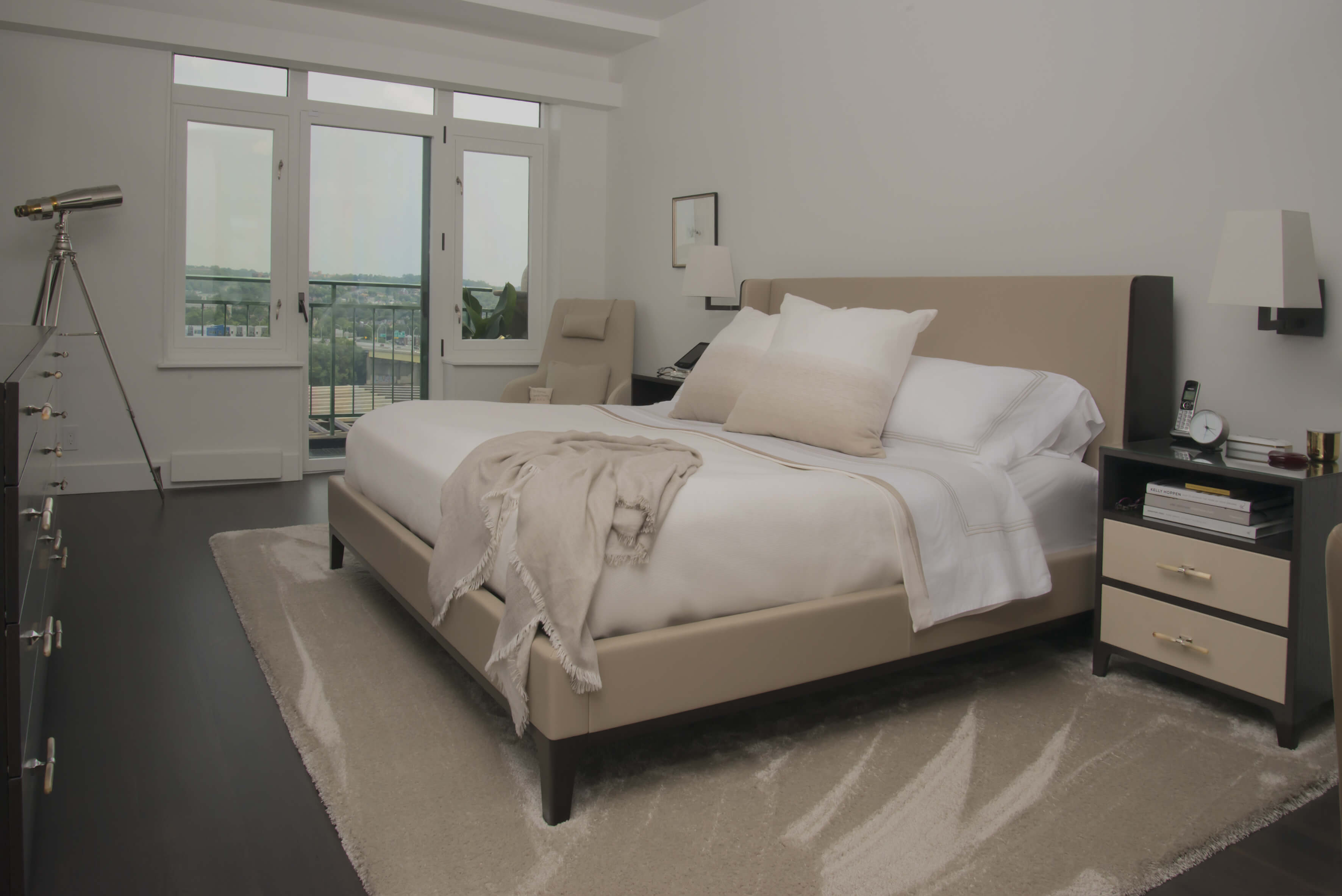 Sophisticated and cozy modern bedroom with warm tones designed by interior designer, RM Interiors.