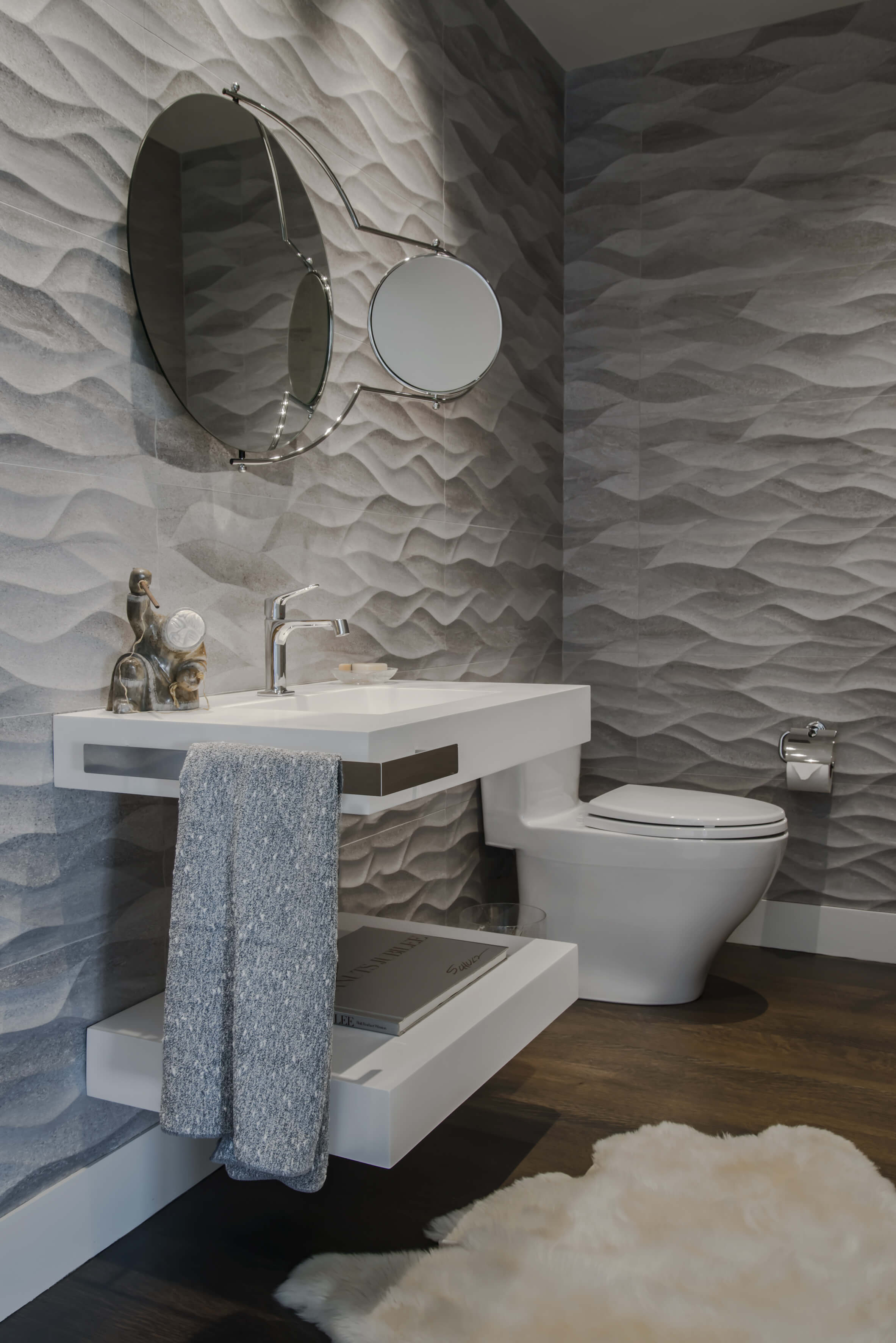 Porcelanosa textured tile bathroom and custom sink with vanity design by interior designer Renan Menninger of RM Interiors.