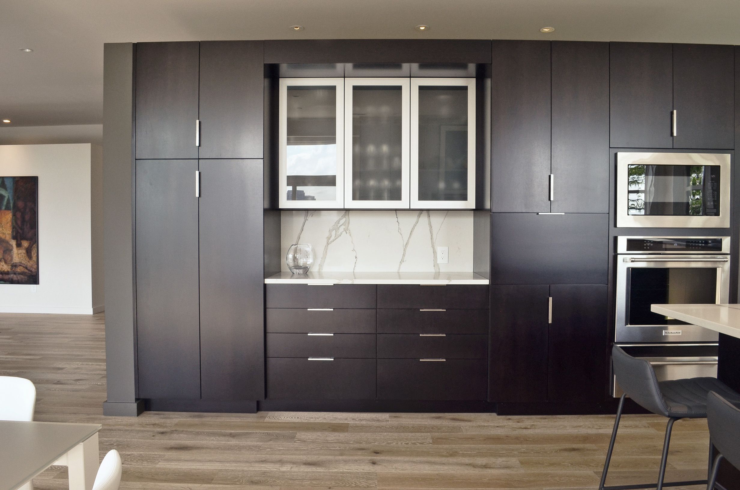 Custom dark wood cabinetry by interior designer, RM Interiors.
