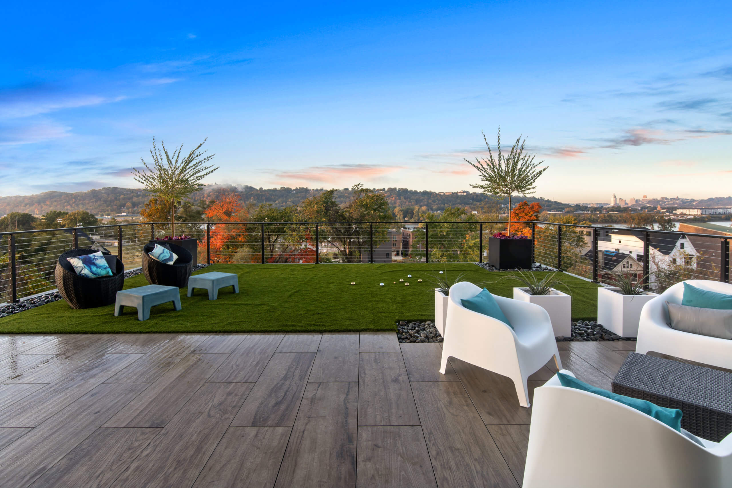 Rooftop patio with astroturf and tile. Designed by Cincinnati Interior Designer, RM Interiors.