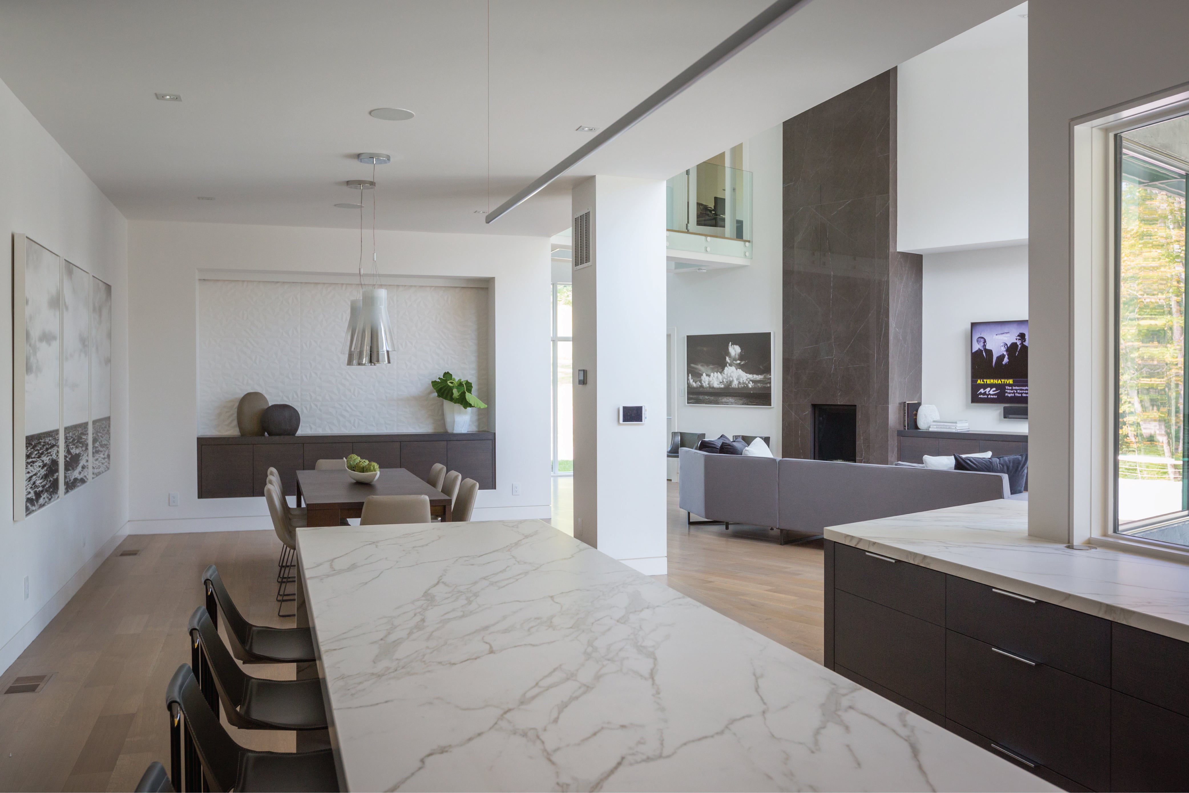 Open concept modern living room, dining and kitchen in this contemporary home designed by interior designer, RM Interiors.