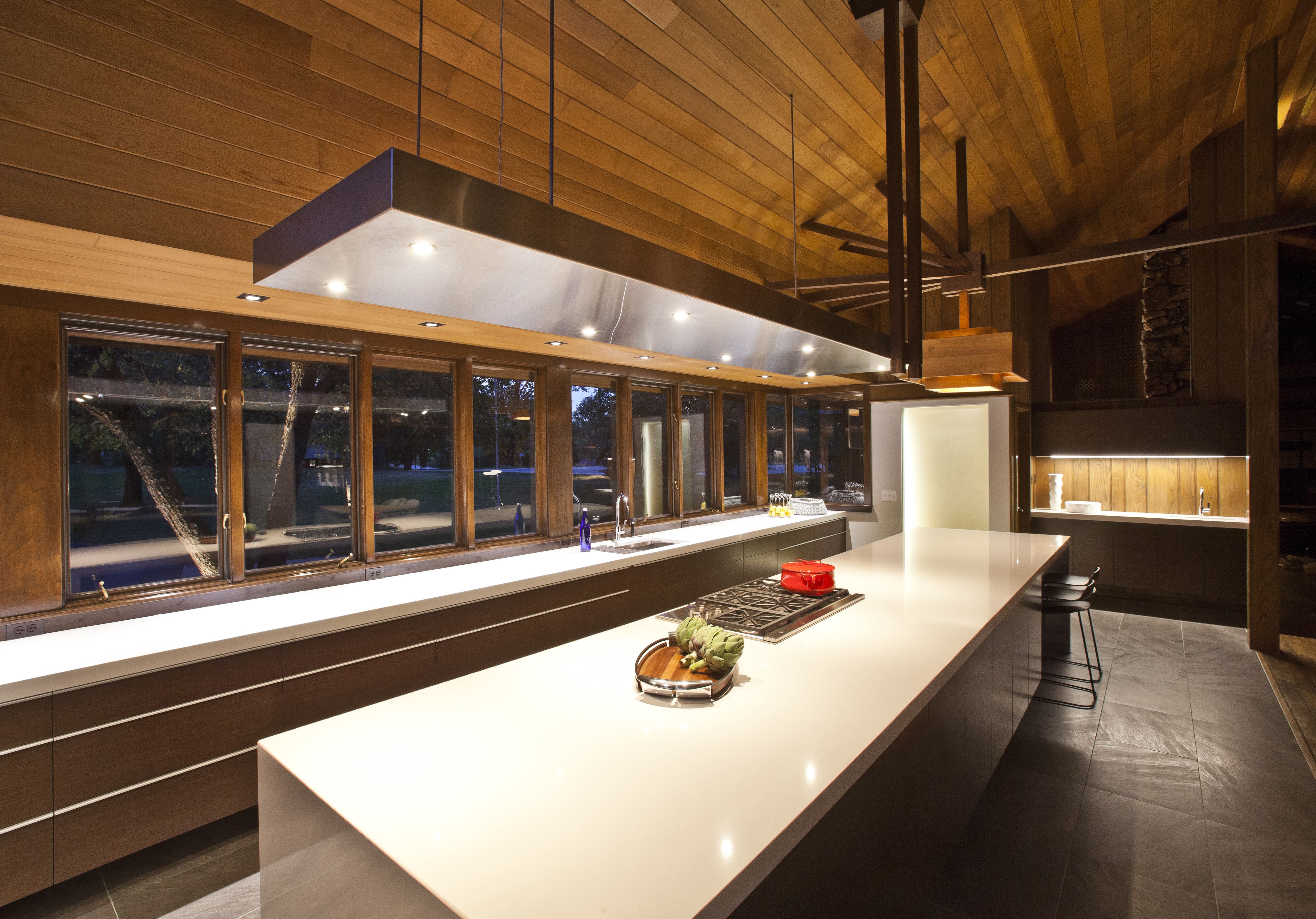 Island lighting detail showing the nighttime experience of this custom kitchen designed by interior designer, RM Interiors of Cincinnati, Oh.